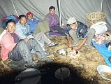 311 Cook Tent At Annapurna North Base Camp - Ang Phuri Sherpa, Dhan Bahadur Tamang, Gyan Tamang, Ram Bahadar Tamang, and Dhansing For dinner, Phuri served me popcorn, and then soup and en enormous plate of vegetarian spaghetti. When I was finished, Gyan ate some of the spaghetti, and Phuri and the porters ate the rest. I enjoyed a cup of hot Tang while Phuri made their dinner of dhal bhat. The porters gave Phuri the food, chopped and washed while Phuri looked after the pot. When they started eating, I went to bed at 19:30 in my roomy two-person tent. The five members of the crew slept in the kitchen tent. From left to right are Ang Phuri Sherpa, Dhan Bahadur Tamang, Gyan Tamang, Ram Bahadar Tamang, and Dhansing.